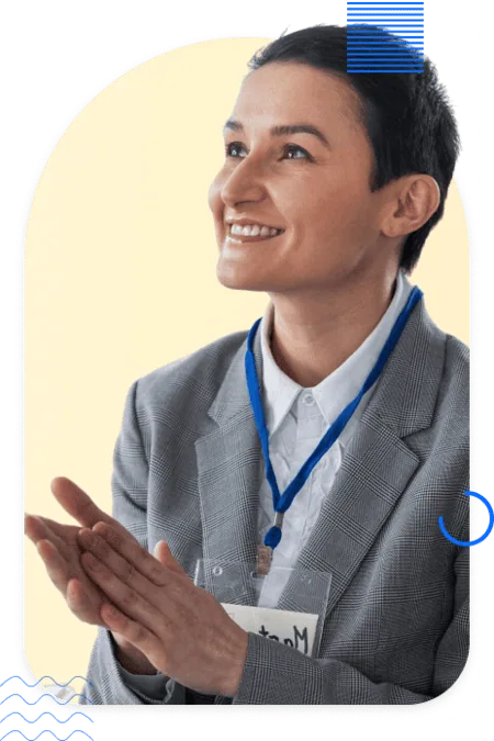 Smiling professional applauding at a conference, representing cross-industry expertise