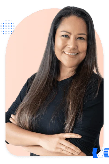 Confident Pardot consultant with long hair smiling at the camera