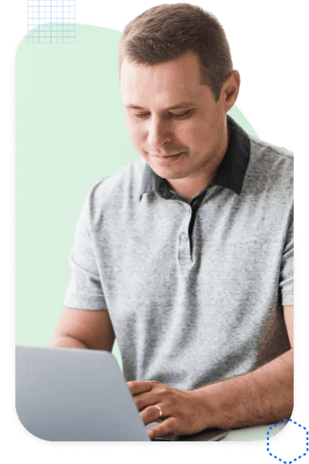 Pardot consultant focused on his laptop while working