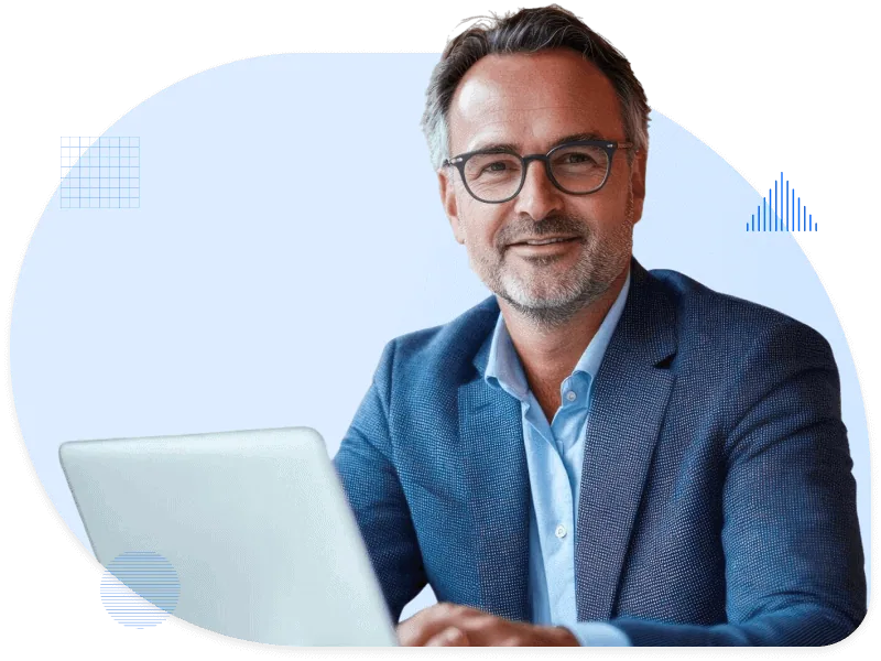 Confident man in suit working on laptop, representing the financial services industry