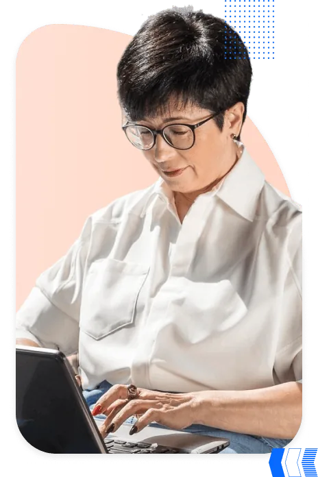 Woman with glasses checking her setup on a laptop