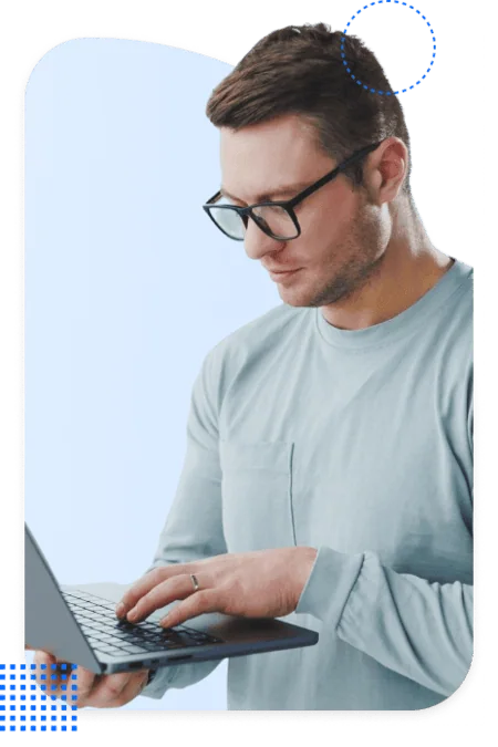 Pardot consultant typing on a laptop