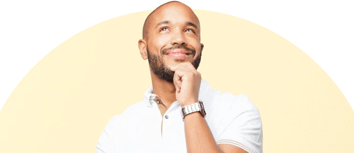 Man smiling thoughtfully and looking up