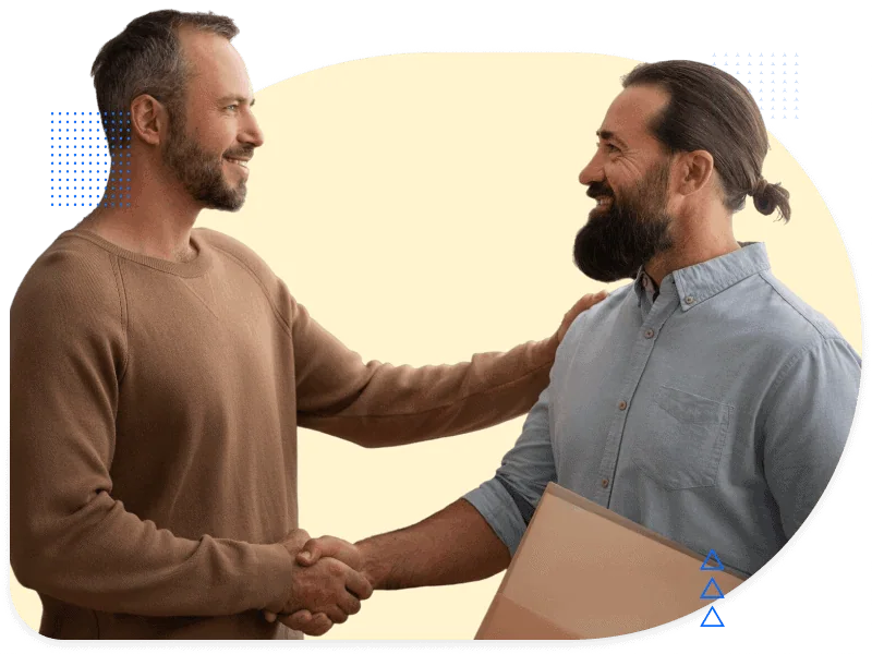 Two men shaking hands and smiling, representing agency collaboration and smooth project handovers